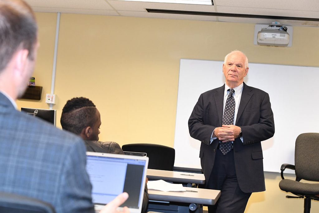 Senator Cardin listening to student ask question in class