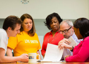 Group of United Way staff consulting in a group