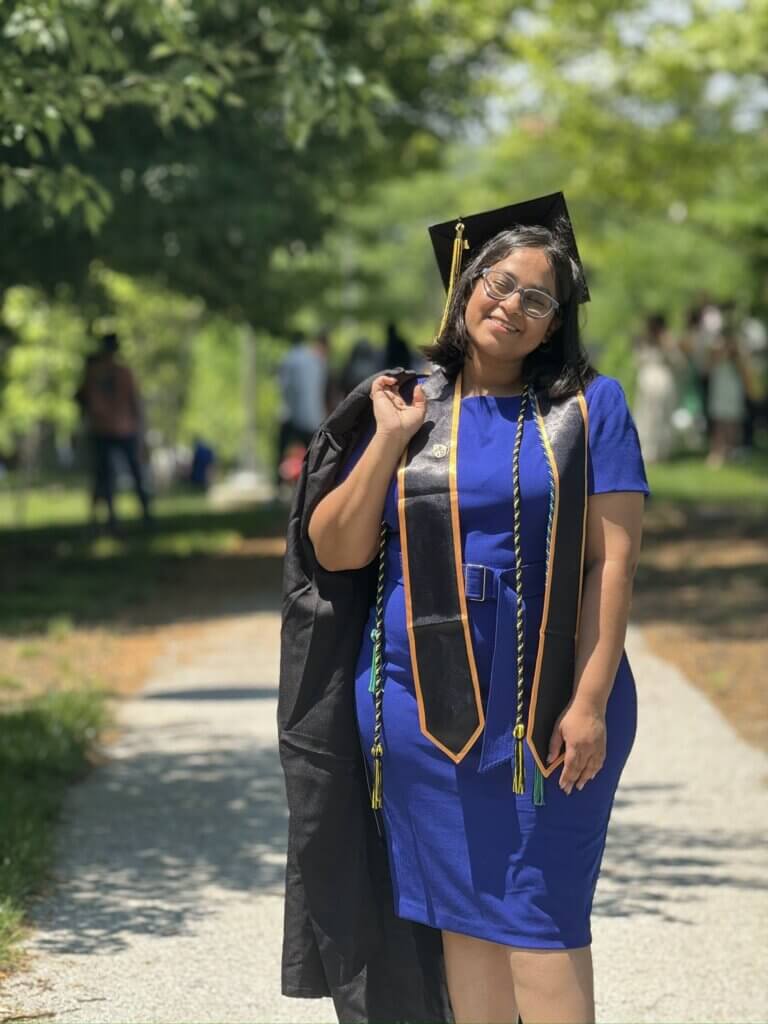 Lalitha Bikkumalla, M.P.S. '24, posing with her cap and gown as she now is ready to enter the world of Healthcare Data Management.