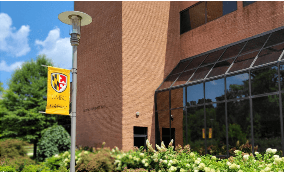 UMBC banner on a pole outside a lecture hall welcoming the largest incoming class.