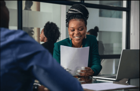 Women interviewing in a professional setting related to job market trends and hiring processes.